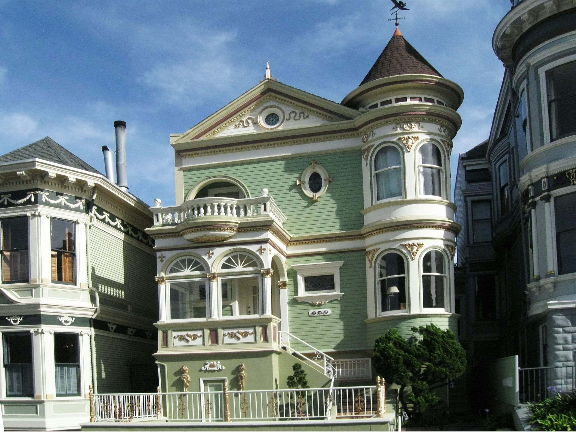 Victorian house with a white balcony